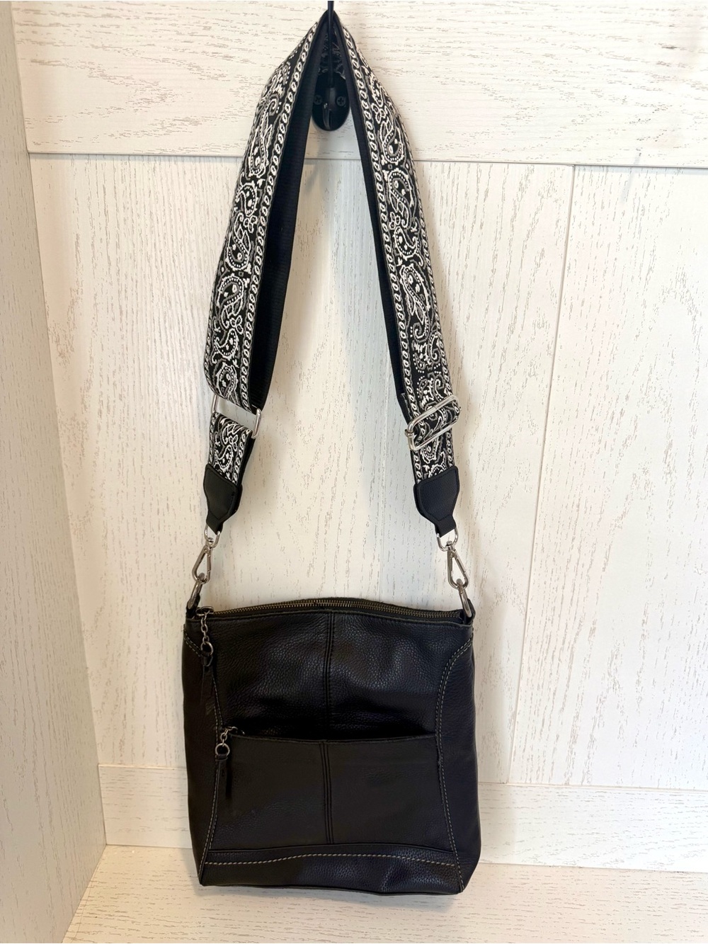 The Sak Black Leather Lucia Crossbody with Black-and-White Paisley Strap